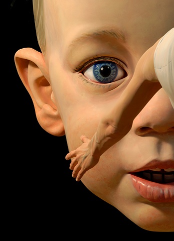 Large figurative polychrome sculpture of a child's head suspended from the ceiling, installed at the National Portrait Gallery in DC