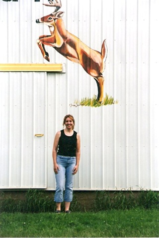 Deer painted on side of metal barn
