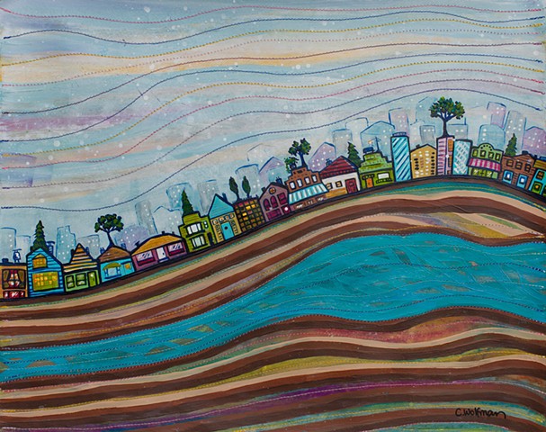 This is an original painting by Chai Wolfman created with paint and thread on paper. Layers of ground, like rings of a tree, are colorful with stitched details. A colorful city scape with rooftop trees flows across the middle of the page.