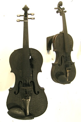 Charred violins and cellos with digital sound elements