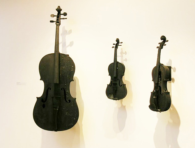 Charred violins and cellos with digital sound elements provided by Mp3 players