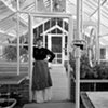Florence Hopewell in her greenhouse, circa 1909