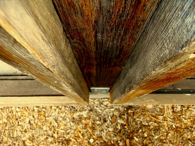 Hardwood column sandwiched between weathered Cedar joinery styles