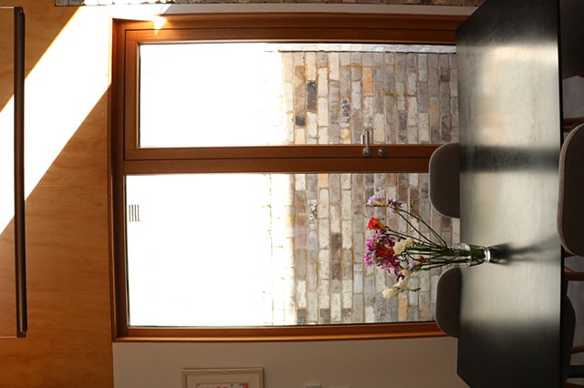 light bouncin goff a wall to get thorough a window