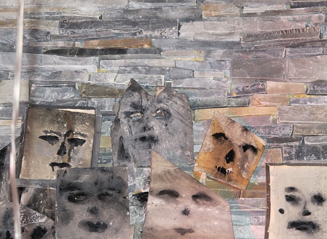 Detail of handmade faux rock wall, and "Suicide Masks"