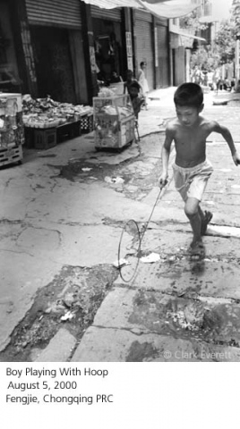 Boy Playing With A Hoop