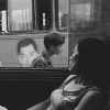 Woman Looking Out Bus Window