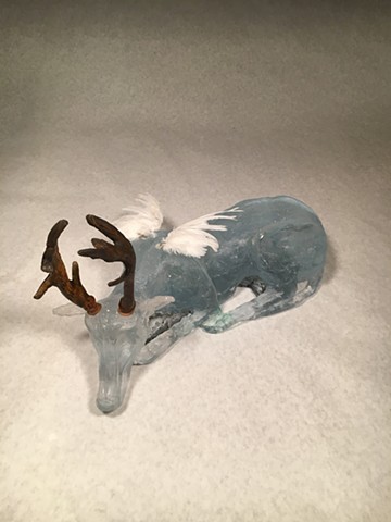 cast glass deer and dog, with quail wings inspired by dreams and memories