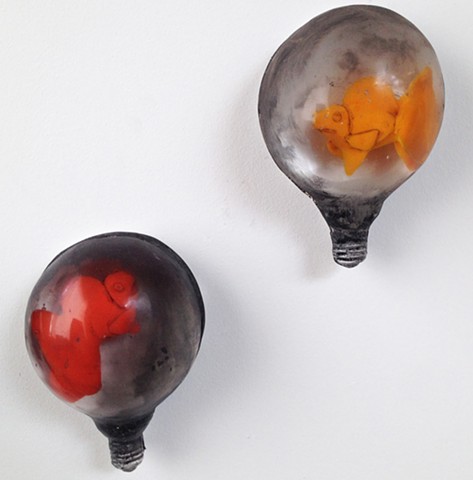 Cast glass light bulb and encased cast glass goldfish. Glass narrative. Storytelling.  Surrealism.