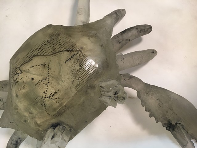 Cast glass crab with etched hiking trail map based upon memory