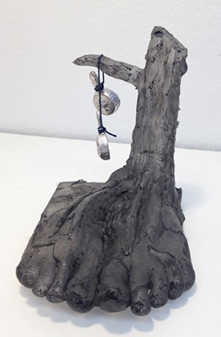 Cast glass house and feet. Artwork inspired by backpacking. Glass narrative. Storytelling. Cast glass sculpture of a house. Surrealism.