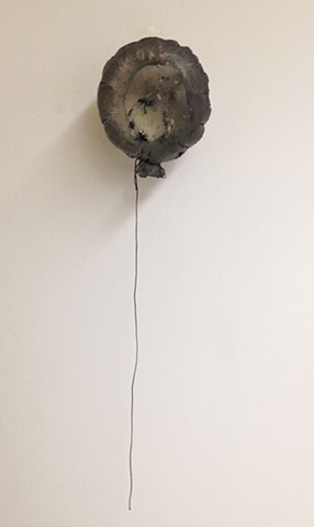 Cast glass balloon with ants encased within. Prism; lens. Ispired by dreams.