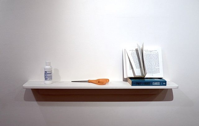 Two shelves with objects from the community that exists in the gallery building. The audience is invited to interact with the objects. 