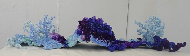 Chenille stem sculptures in the shape of a coral reef or undersea cave