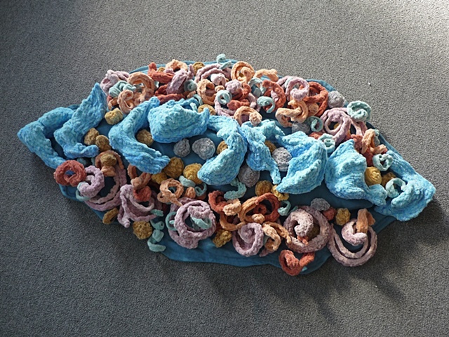 Chenille stem sculpture of a water current, part of the movement of water series.