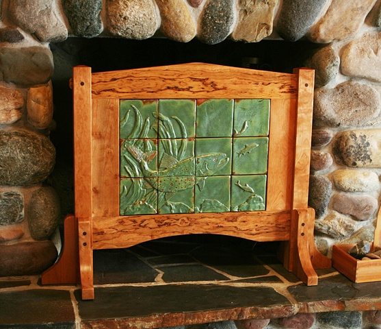 Dramatic screen built from knotty cherry with a one of a kind, hand-carved ceramic tile mural that depicts a Mackinaw (Lake Trout} in pursuit of Whitefish.
