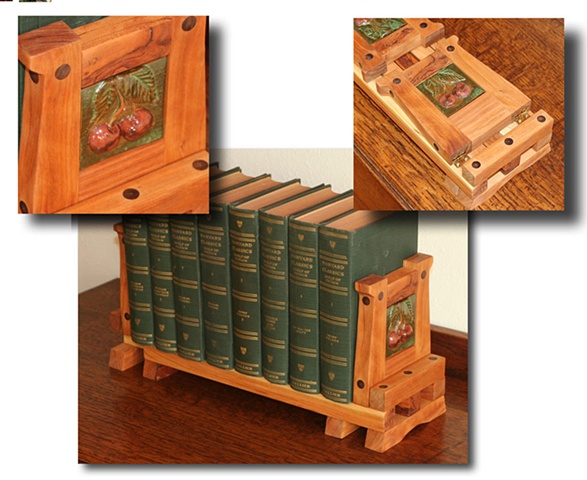 Arts & Crafts style expandable bookrack built from Knotty Cherry wood and hand-carved ceramic tiles