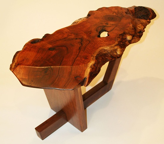With a century old mesquite burl top and a black walnut base, this table has a sculptural quality that pays homage to master woodworker George Nakashima.