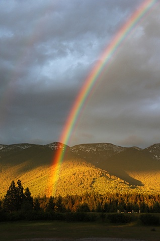 A late Spring rainbow over the Swan Mountains in northwest Montana.