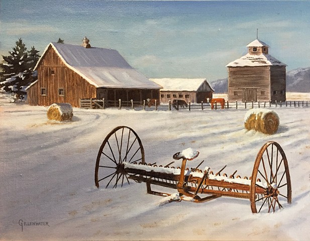 "SEASONS PAST" - A rusted relic of a hay rake from the early 20th century shares a snow covered field with hay bales from the 21st century.