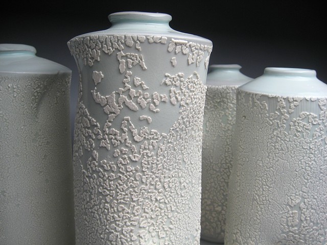 thrown and altered porcelain, celadon glaze, white crawl glaze, vase,