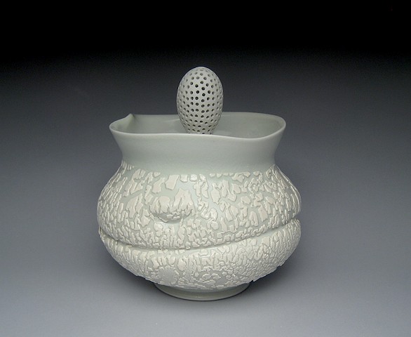 thrown and altered porcelain, celadon glaze, white crawl glaze, covered jar,