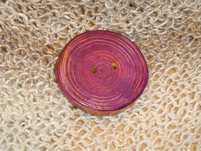 This Round Purple Hand Cut Wood button