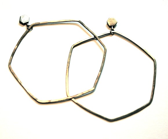 hoop earring made from oxidized brass with silver post by Jennifer Bennett