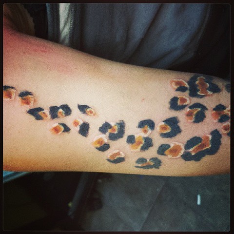 leopard print tattoo by tatupaul.com