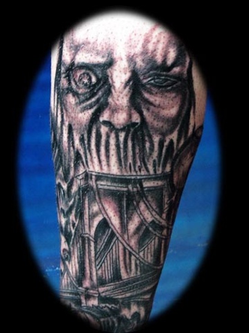 evil face tattoo by tatupaul.com