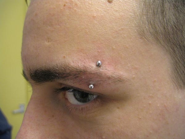 eye brow piercing by tatupaul