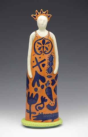 Female figure in dress with floating motifs and headpiece