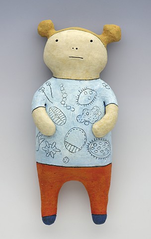 clay ceramic wall wally single cell paramecium girl sculpture by sara swink pigtails