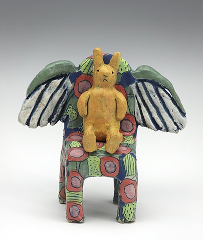 Ceramic figure rabbit wings chair by Sara Swink