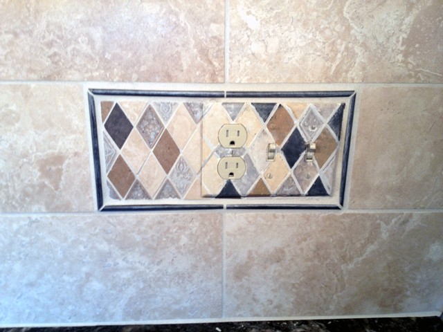 Painted  switchplate to match tile backsplash