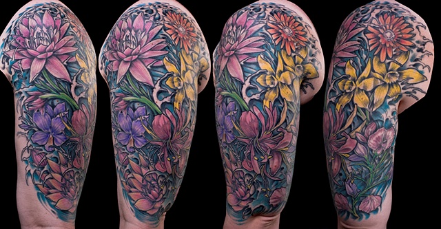 Floral daisy flower lily sweet pea color sleeve tattoo