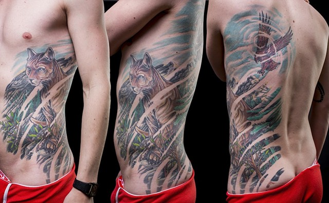 cougar and hawk side rib piece colour tattoo
