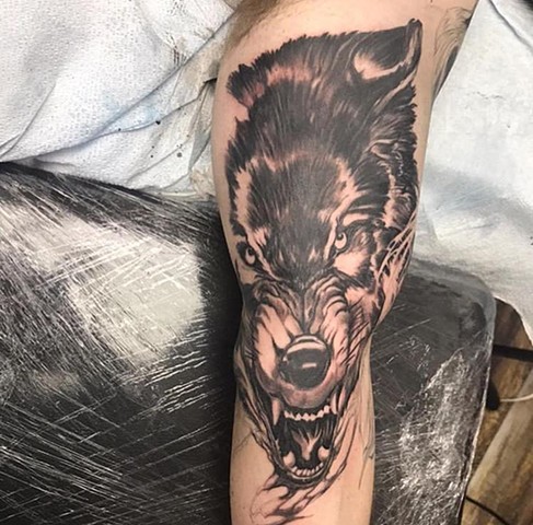 Black and grey sleeve tattoo in semi realistic illustrative wildlife Tattoo