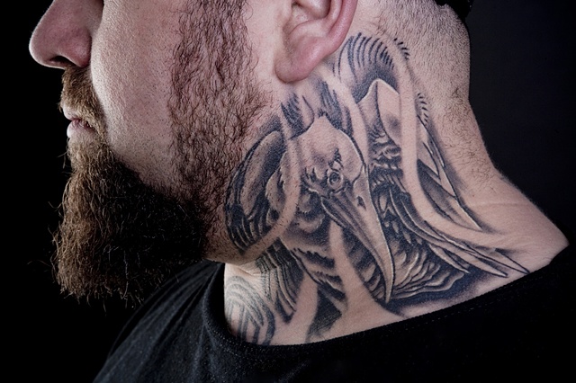 bird on the neck black and grey tattoo