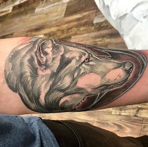 Black and grey with color wolf arm tattoo semi realistic illustrative custom design
