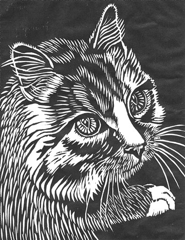 a woodcut of a cat's head and paw by Leslie Moore of PenPets