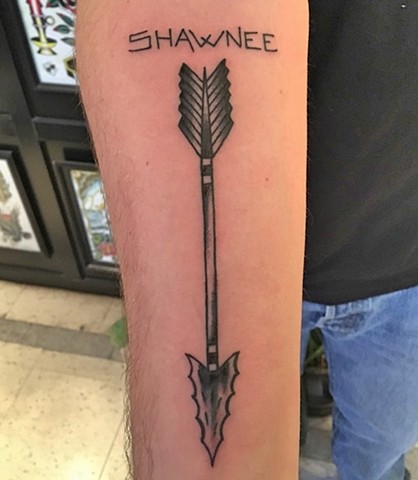Shawnee arrow tattoo by Kc Carew at Gold Standard Tattoo in Bend, OR.