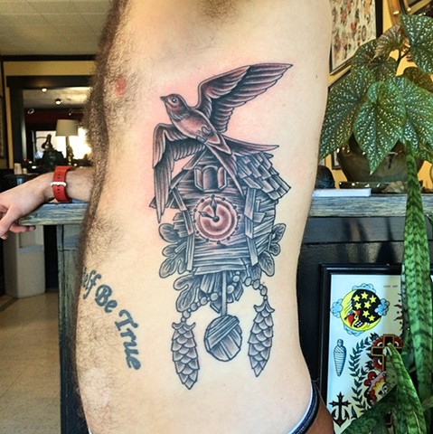 Antique wooden cuckoo clock and sparrow tattoo by Dirk Spece at Gold Standard Tattoo in Bend, OR.