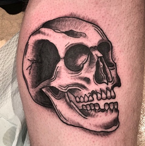 Skull tattoo by Kc Carew at Gold Standard Tattoo in Bend, OR.