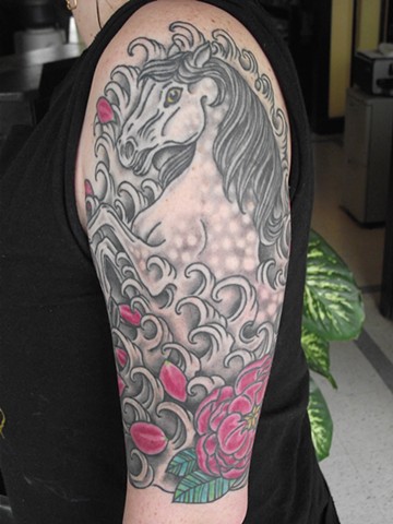 Horse, flower & waves half sleeve (front) tattoo by Dirk Spece at Gold Standard Tattoo in Bend, OR.
