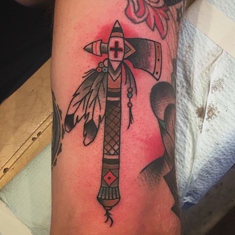 Tomahawk tattoo by Kc Carew at Gold Standard Tattoo in Bend, OR.