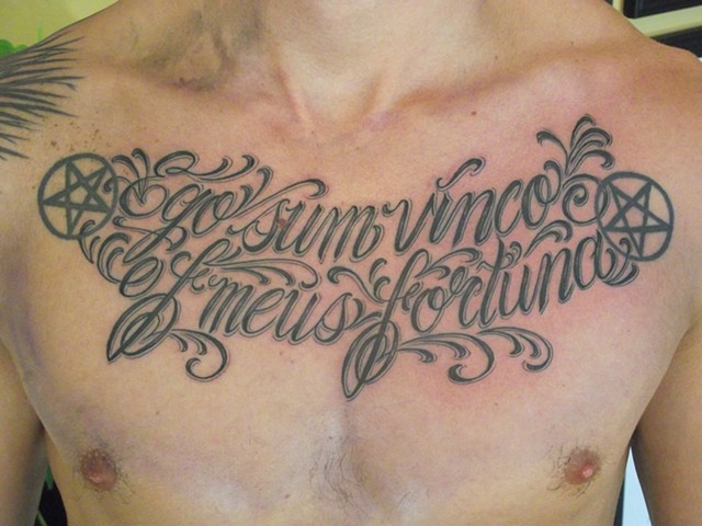 Black and gray text chest tattoo. Dirk Spece. Gold Standard Tattoo Shop. Bend, Oregon.