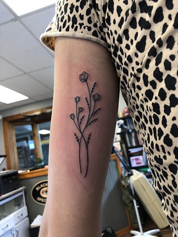 Little flowers tattoo by Kc Carew at Gold Standard Tattoo in Bend, Oregon