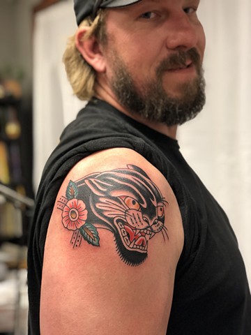 Panther & flower shoulder tattoo by Kc Carew at Gold Standard Tattoo in Bend, Oregon