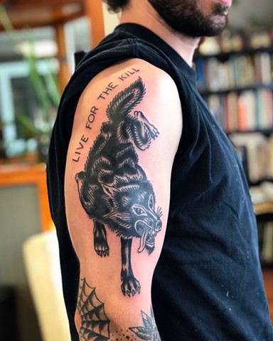 Live for the kill wolf tattoo by Kc Carew at Gold Standard Tattoo in Bend, Oregon